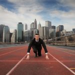Businessman starting new venture, on a race track toward his new path (the photo is analogy)